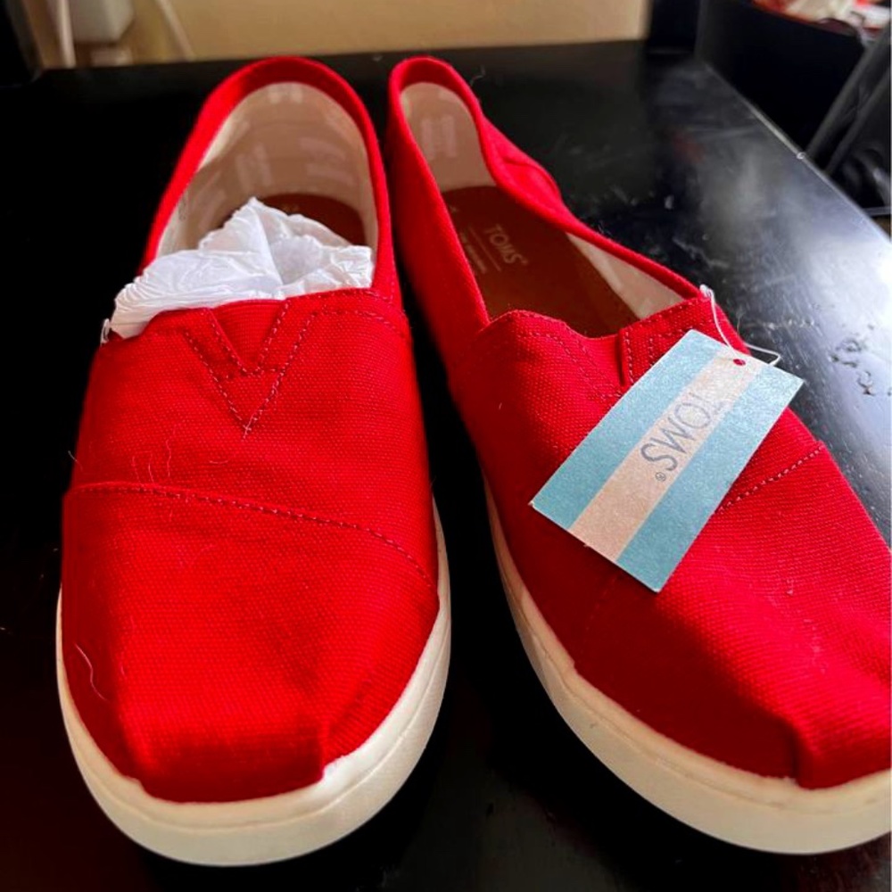 Never worn red Tom’s slip on - size Y5 but fit like W6